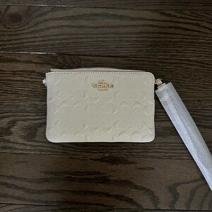 Small White Coach Wristlet